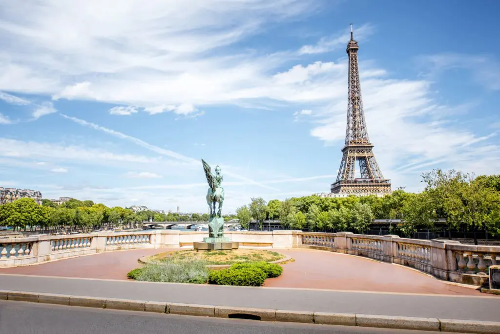French immigration lawyer services in France | View of the Eiffel Tower and a statue