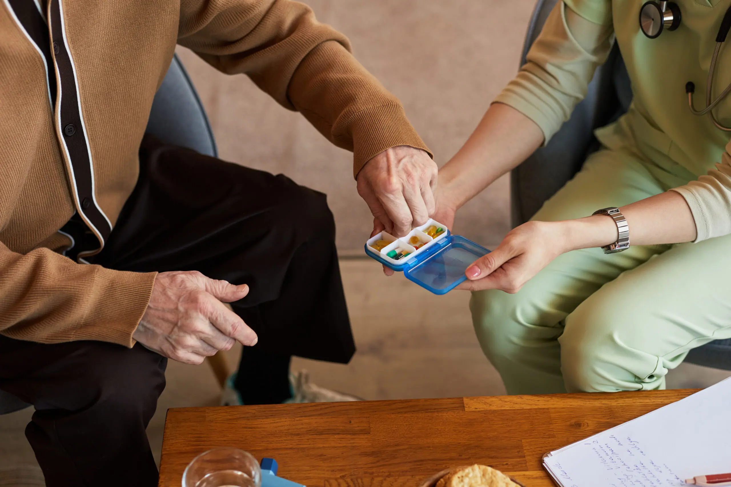 Doctor consulting with a patient in France, illustrating PUMA universal health coverage for long-stay visa holders