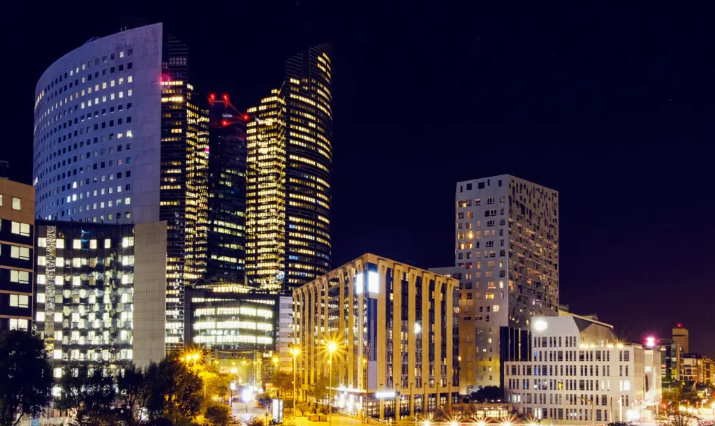 La Défense business district in Paris lit up at night, illustrating types of companies in France for foreign entrepreneurs